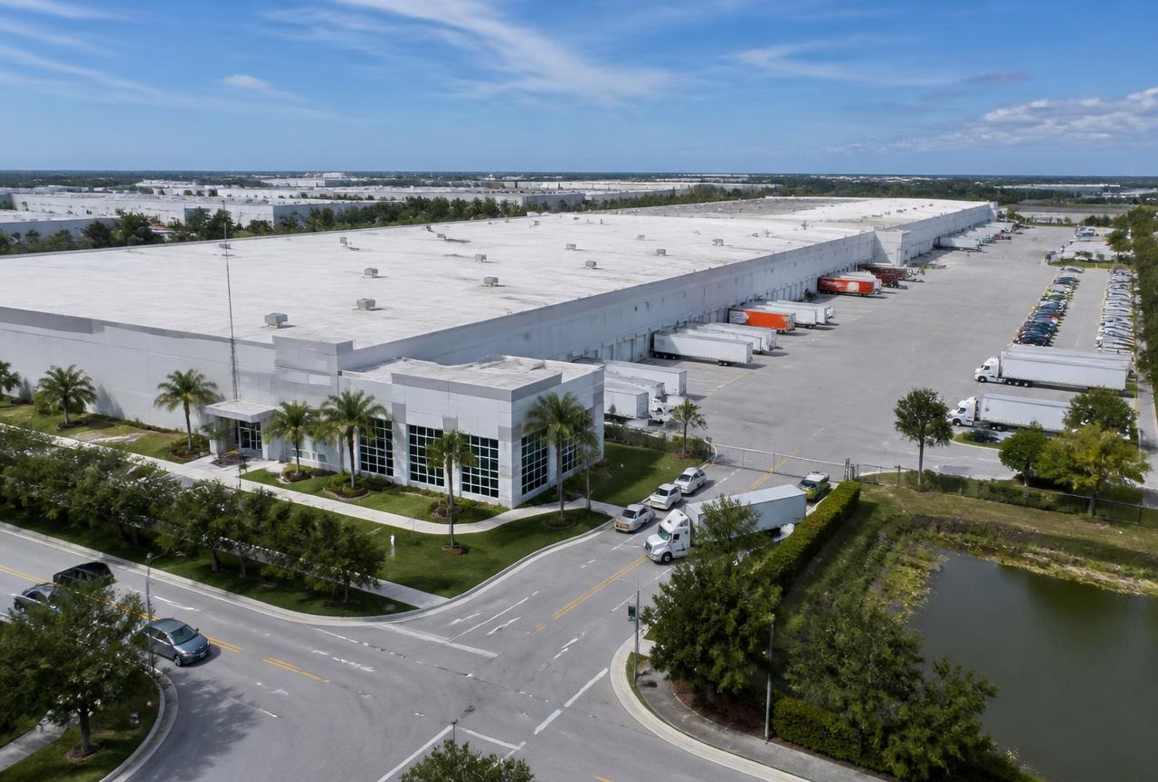 Aerial view of a Doral, Florida warehouse district with loading docks and trucks